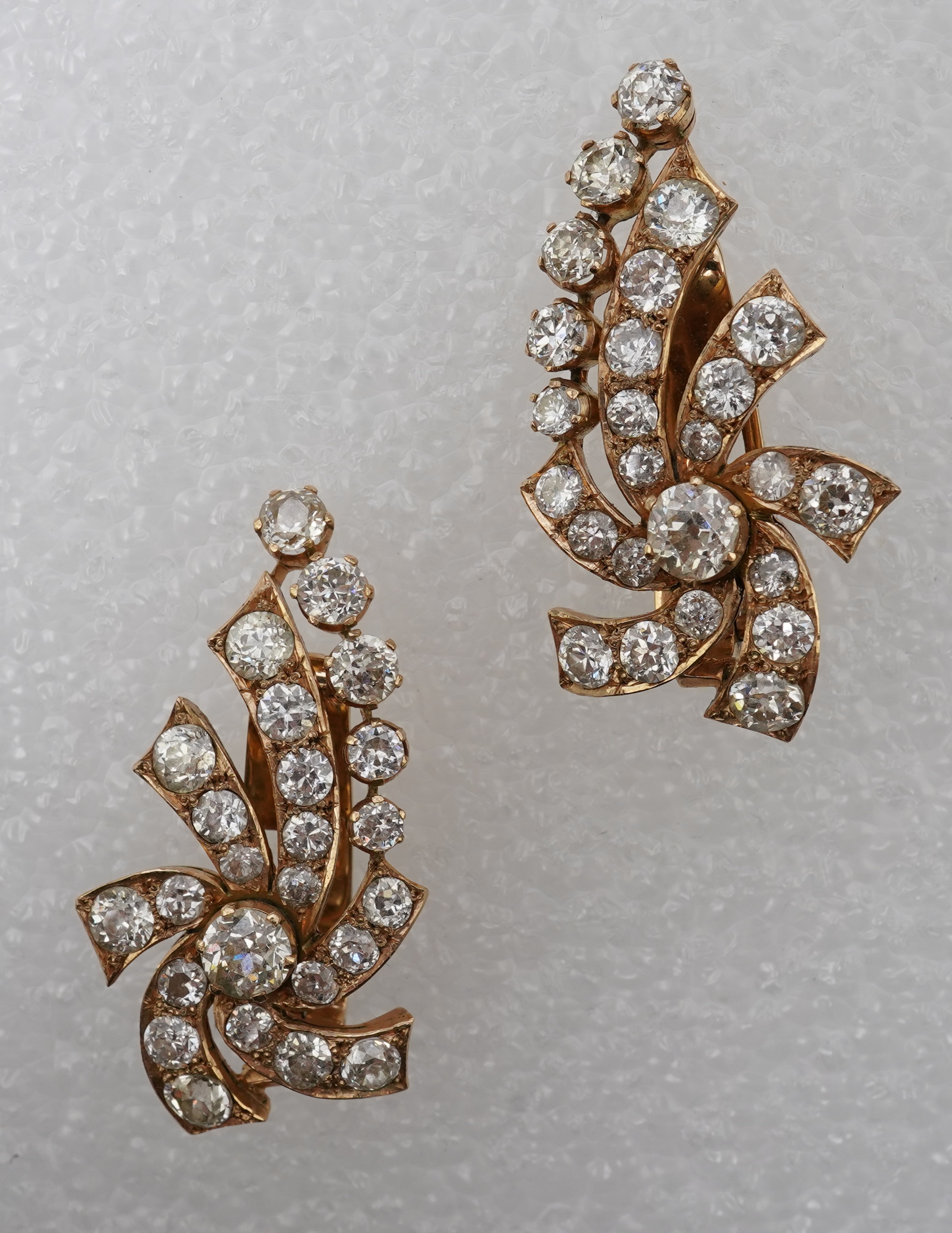 A pair of diamond ear clips, mid 20th century